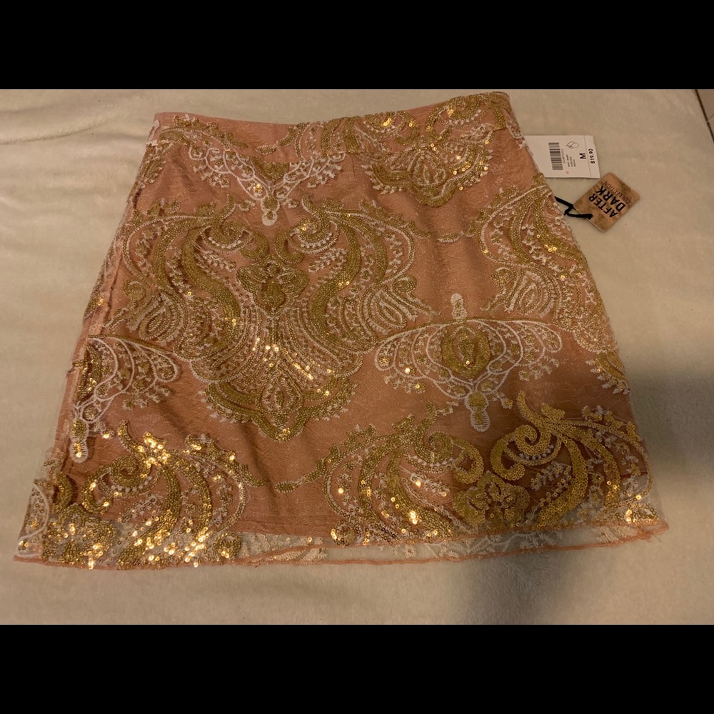 Nude and gold skirt.